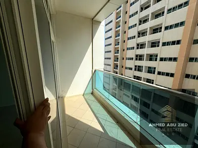 Two bedrooms and a living room for annual rent, fully furnished, with a partial sea view - Al Rashidiya 3 - Ajman One Towers