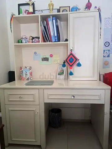 Off white wooden study desk with hutch and storage cabinet together with grey study/gaming chair