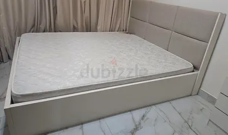 Queen bed frame with upholstered headboard and mattress - good condition