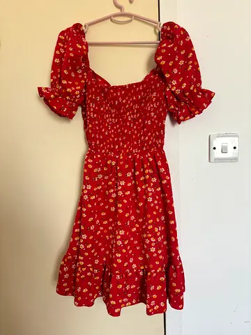 Red floral short sleeve dress with smocked bodice