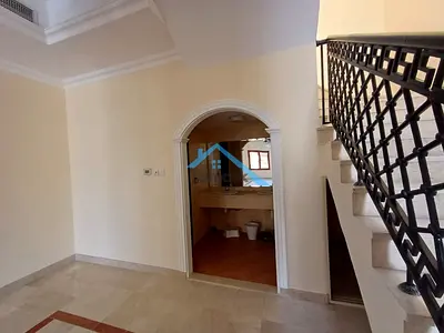 A villa for rent in Mirdif, featuring 4 bedrooms and a practical design spread over two floors. The villa boasts multiple rooms, open-plan living area