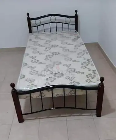 Single metal and wood bed frame with mattress