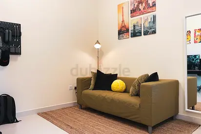 2-seater olive green sofa in good condition
