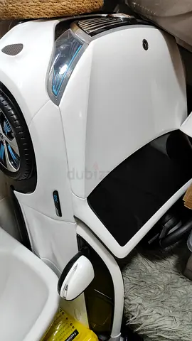White electric ride-on toy car for kids (battery-powered) Mercedes Benz