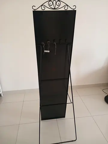 Tall black metal mirror
