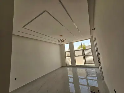 communities offering a peaceful environment and convenient access to major roads, schools, shopping centers, and essential services. The villa featur