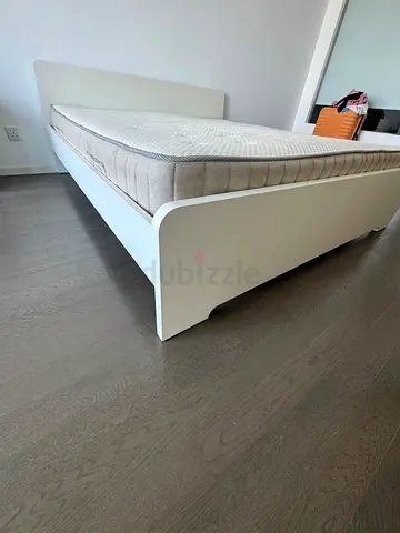 Excellent condition (Ikea brand) King size bed with high quality mattress for quick sale.