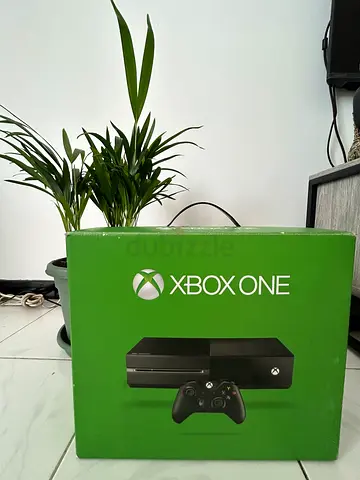 Xbox One X console + 2 controllers + games stand in original box - good condition