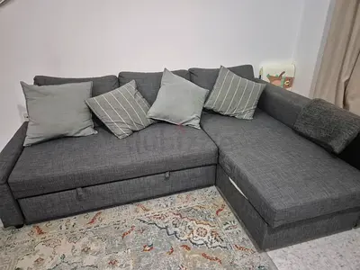 Grey L-shaped IKEA Sofa Bed and Cushions