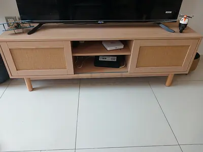Light wood TV unit with rattan sliding doors - good condition