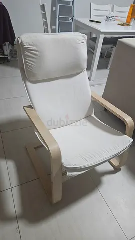 Light wood frame lounge chair with removable white cushions