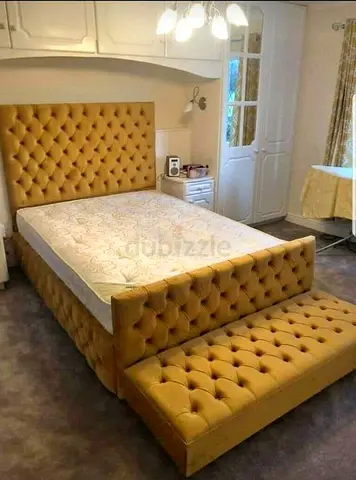 King-size tufted bed frame with upholstered bench — mustard/gold
