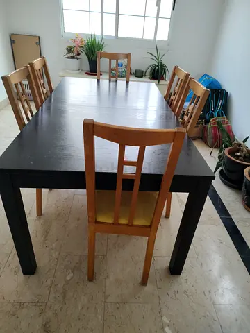 Solid black dining table with 6 wooden chairs - good condition