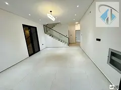For annual rent in Al Helio, Ajman: a villa with 4 master bedrooms, high-end finishes, and an excell