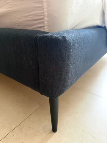 Dark blue upholstered bed frame with short tapered legs - queen. Incl mattress.