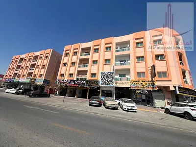 Two-bedroom apartment with a living room and central air conditioning; prime location in Al Rawda 3.
