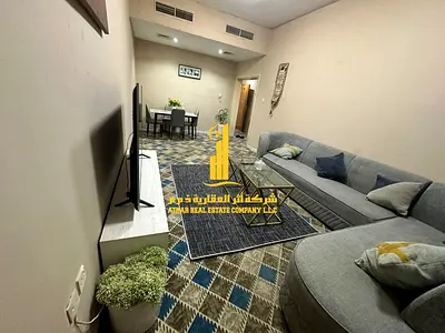 Luxury two-bedroom apartment with a living room and balcony. Ajman, Al Rashidiya 3. Fully furnished, available for monthly rent.