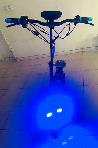 Electric kick scooter with front blue LED lights - good condition