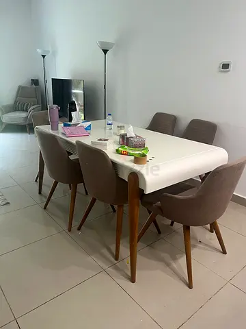 White dining table with 6 upholstered chairs - good condition