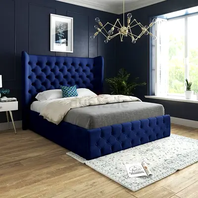 King-size navy blue tufted upholstered bed with wingback headboard