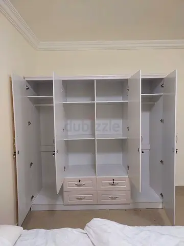 White 4-Door Wardrobe with Shelves and Drawers
