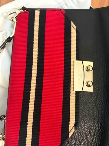 Kate spade bag like new black leather crossbody bag with red striped fabric front panel