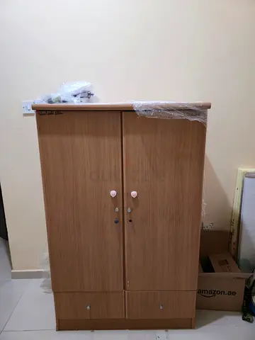 Two-door wooden wardrobe with drawers - light oak finish, good condition