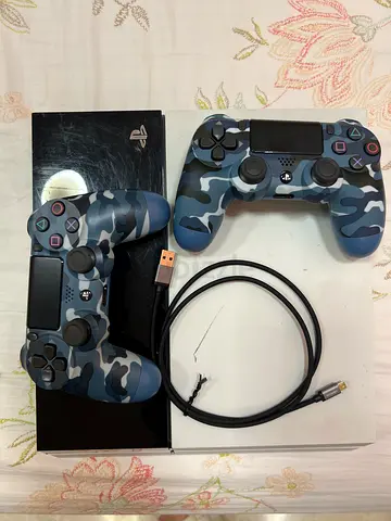 Sony PlayStation 4 Slim with 2 Camo DualShock 4 Controllers