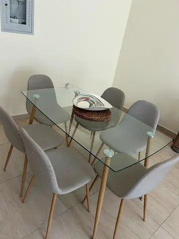 Glass Top Dining Table with 6 Light Grey Fabric Chairs