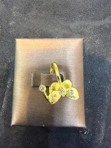 Gold floral ring with small stones - elegant adjustable design