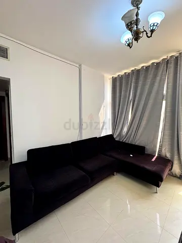 6 seater black L shape neat and clean sofa