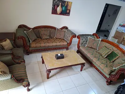 Classic carved wooden 3-piece sofa set with coffee table - good condition
