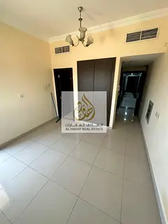 Studio with balcony for annual rent with built-in wardrobe and separate kitchen