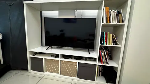 White entertainment TV unit with shelves and storage cubes