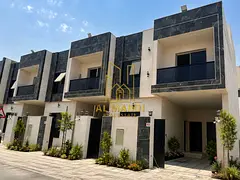 Townhouse for sale, price includes registration fees, modern design, prime location with a rooftop t