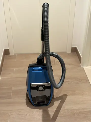 Used canister vacuum cleaner - compact blue unit, from Miele