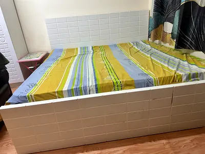 Well-maintained bed cot with mattress available for sale