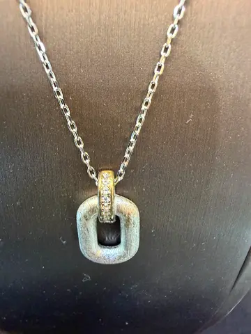 Silver pendant necklace with small clear stones