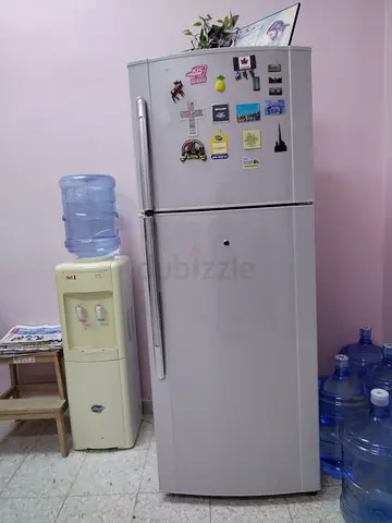 Used double-door refrigerator with top freezer - good working condition