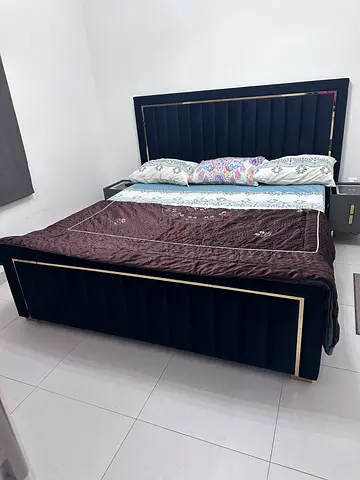 King-size upholstered bed frame with headboard in black velvet and with mattresses