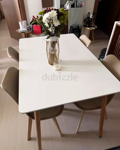 Modern white dining table with 4 beige chairs - good condition