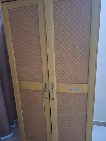 Light wood double-door wardrobe with woven paneling - good condition