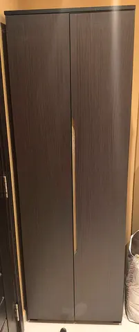 Two-door tall wardrobe / storage cabinet - dark wood finish