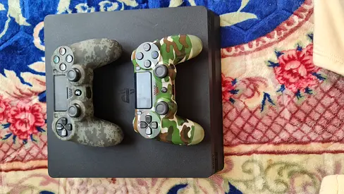 PlayStation 4 Slim with 2 Camouflage DualShock 4 Controllers