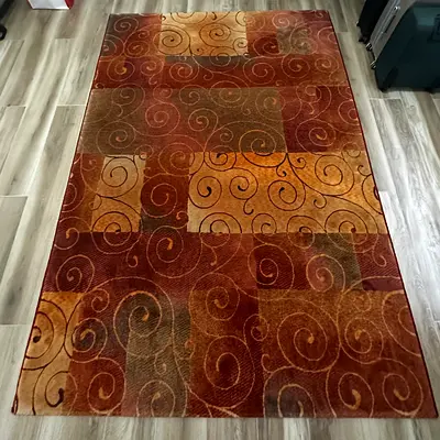 Carpet 170*240 Light use modern swirl pattern rug - warm tones, good condition