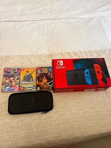 Nintendo Switch console with 3 games and carry case (boxed) - Neon Joy-Con