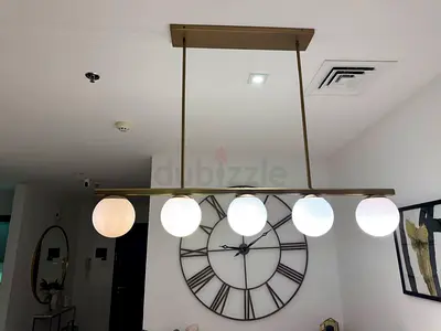 Modern Brass Linear Pendant Light with 5 Globe Shades