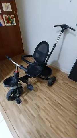 Used black toddler tricycle with push handle - good condition