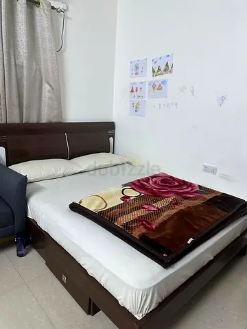 Solid wood double bed frame with headboard - good condition