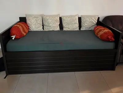 Solid dark wood daybed with mattress and cushions - good condition